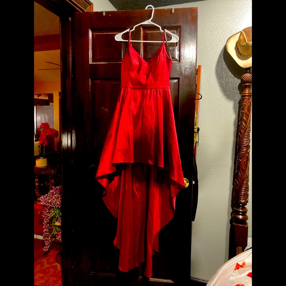 Beautiful red high front and trail back dress with a V-neck chest
